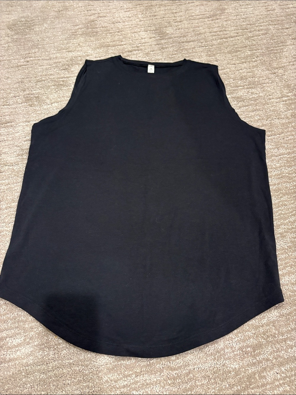 NWOT Lululemon black sleeveless tank top. Loose fit. Size 8.